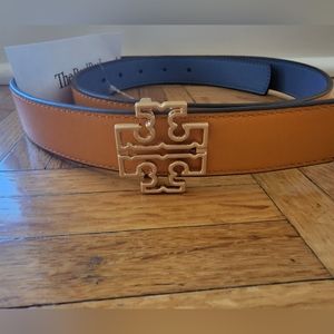 Brand new, never been worn reversible Tory Burch belt in orange and blue.